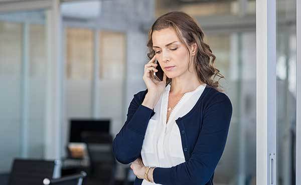 woman-phoning-insurance-about-house-fire.jpg